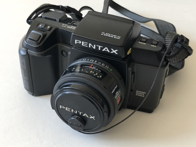 Pentax SF1 film camera with lens