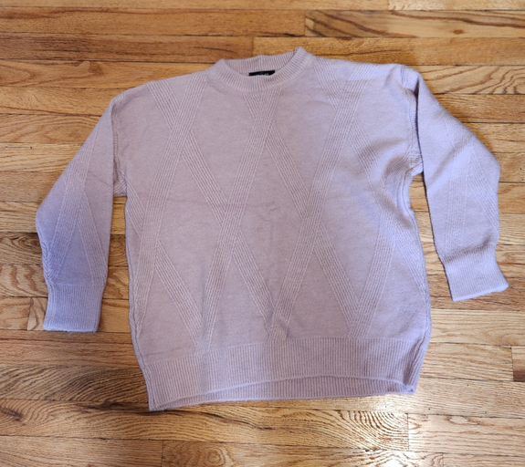 light-colored knit sweater