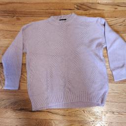 light-colored knit sweater