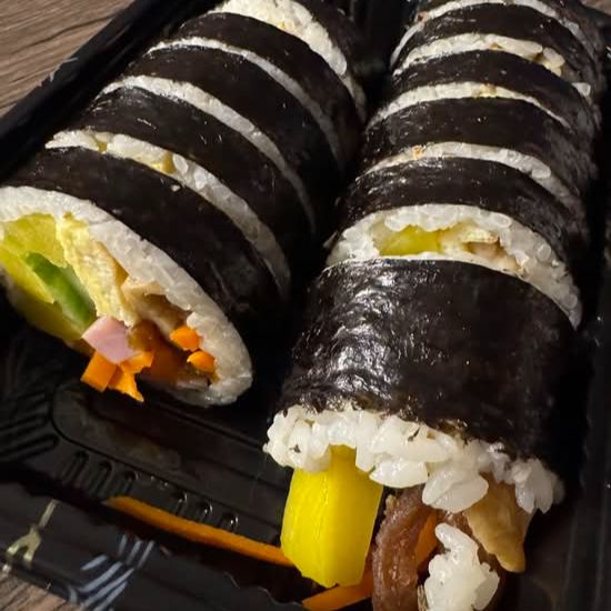 Fresh handcrafted signature gimbap rolls at Rolly Kimbab in Flushing, Queens