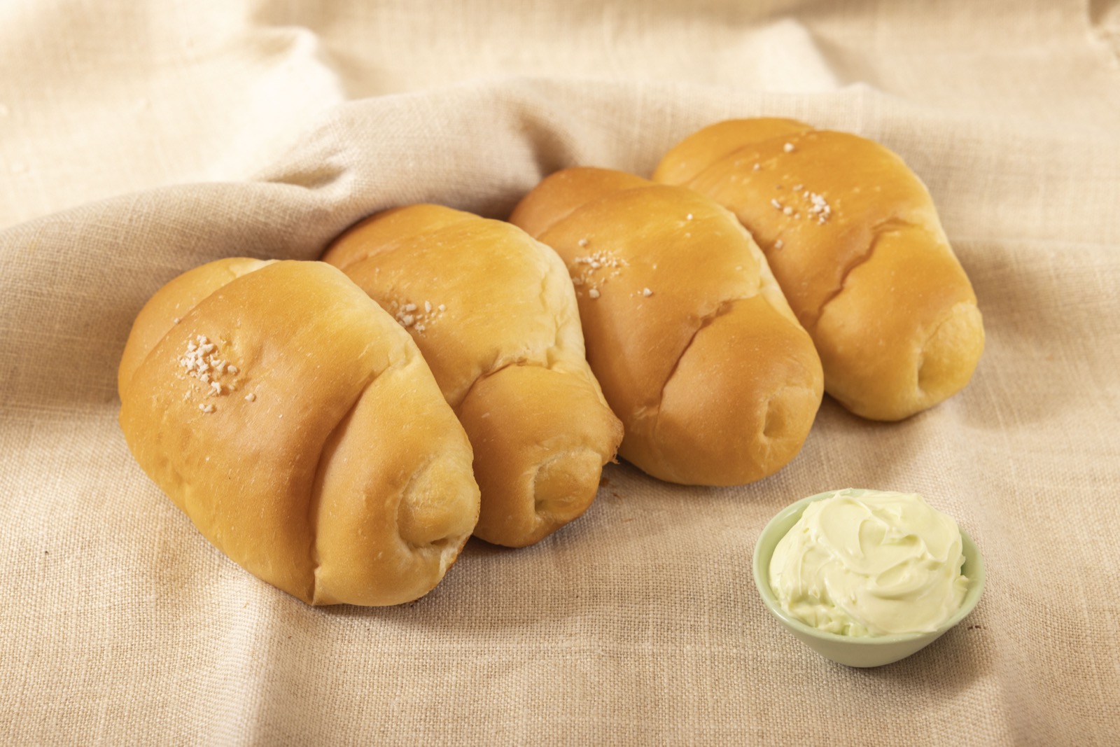 Handcrafted Korean salt bread rolls with coarse sea salt and golden buttery crust
