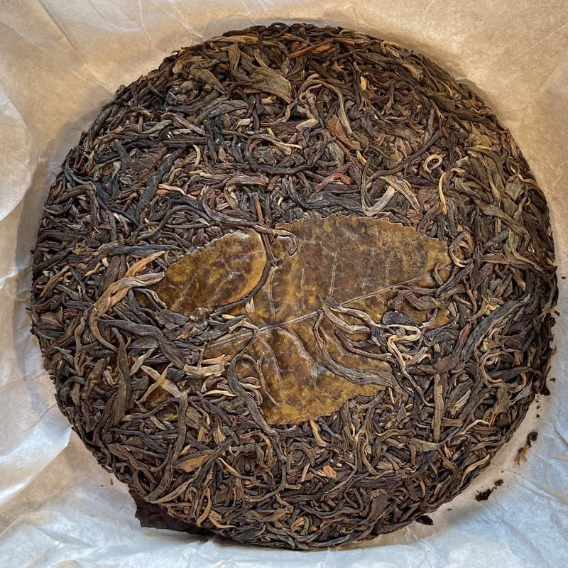 Traditional raw and ripe pu-erh tea bing cakes from Yunnan